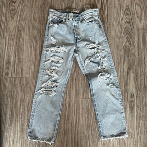 Levi’s light wash wedgie straight jeans with a lot of holes size 27